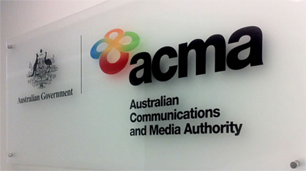 Australian Government | ACMA: Australian Communications and Media Authority logos printed on a glass panel. Image credit: acma.gov.au