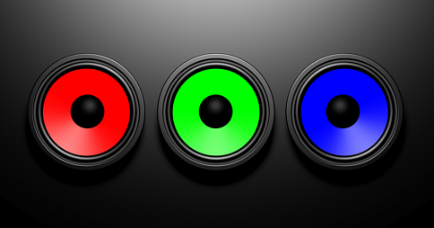 Three colourful speakers on a dark background