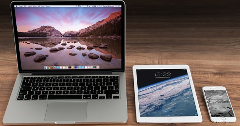 Apple products on display. From left to right: MacBook, iPad Air and iPhone 6 Plus