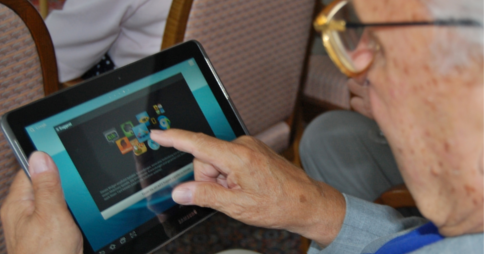 Elderly person using a Samsung tablet device. Image credit: Wikipedia commons