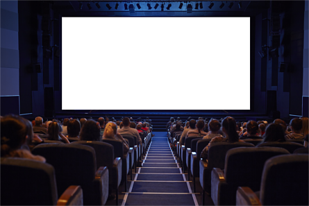 Crowded cinema with people seated in front of a blank screen