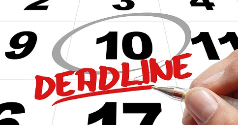 Number 10 circled on calendar with the word 'Deadline' written below; right hand holding pen underneath
