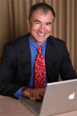 Professor Peter Hutchings using a MacBook