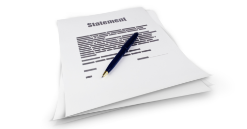 Pen resting on top of a document titled 'Statement'