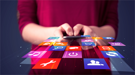 Woman holding a smartphone with app icons emerging forward