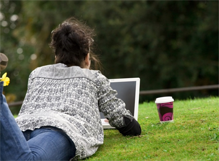 Woman accessing a document from her laptop.