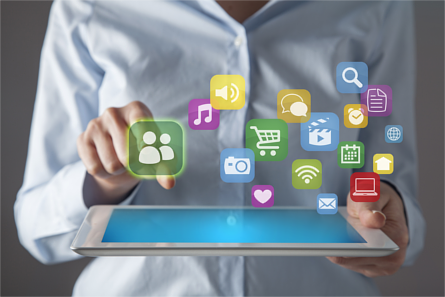 Woman using a tablet with internet icons appearing