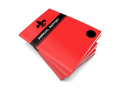 A stack of three annual reports